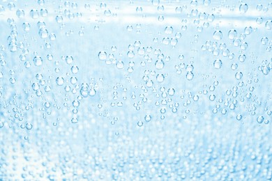 Image of Soda water with bubbles as background, closeup