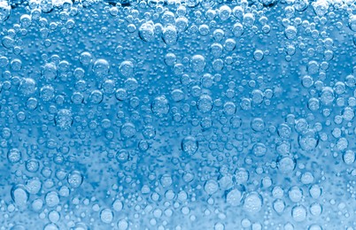 Image of Soda water with bubbles as background, closeup