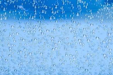 Image of Soda water with bubbles as background, closeup