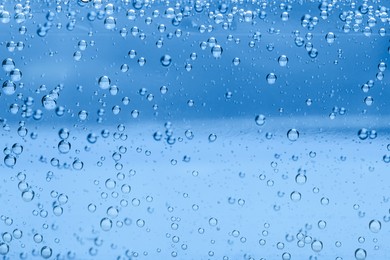 Image of Soda water with bubbles as background, closeup