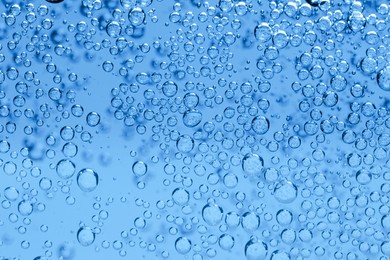Image of Soda water with bubbles as background, closeup