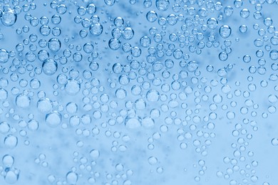 Image of Soda water with bubbles as background, closeup