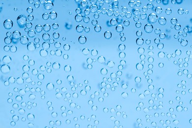 Image of Soda water with bubbles as background, closeup