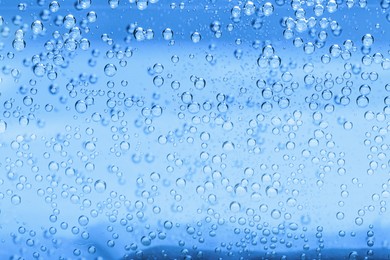 Image of Soda water with bubbles as background, closeup