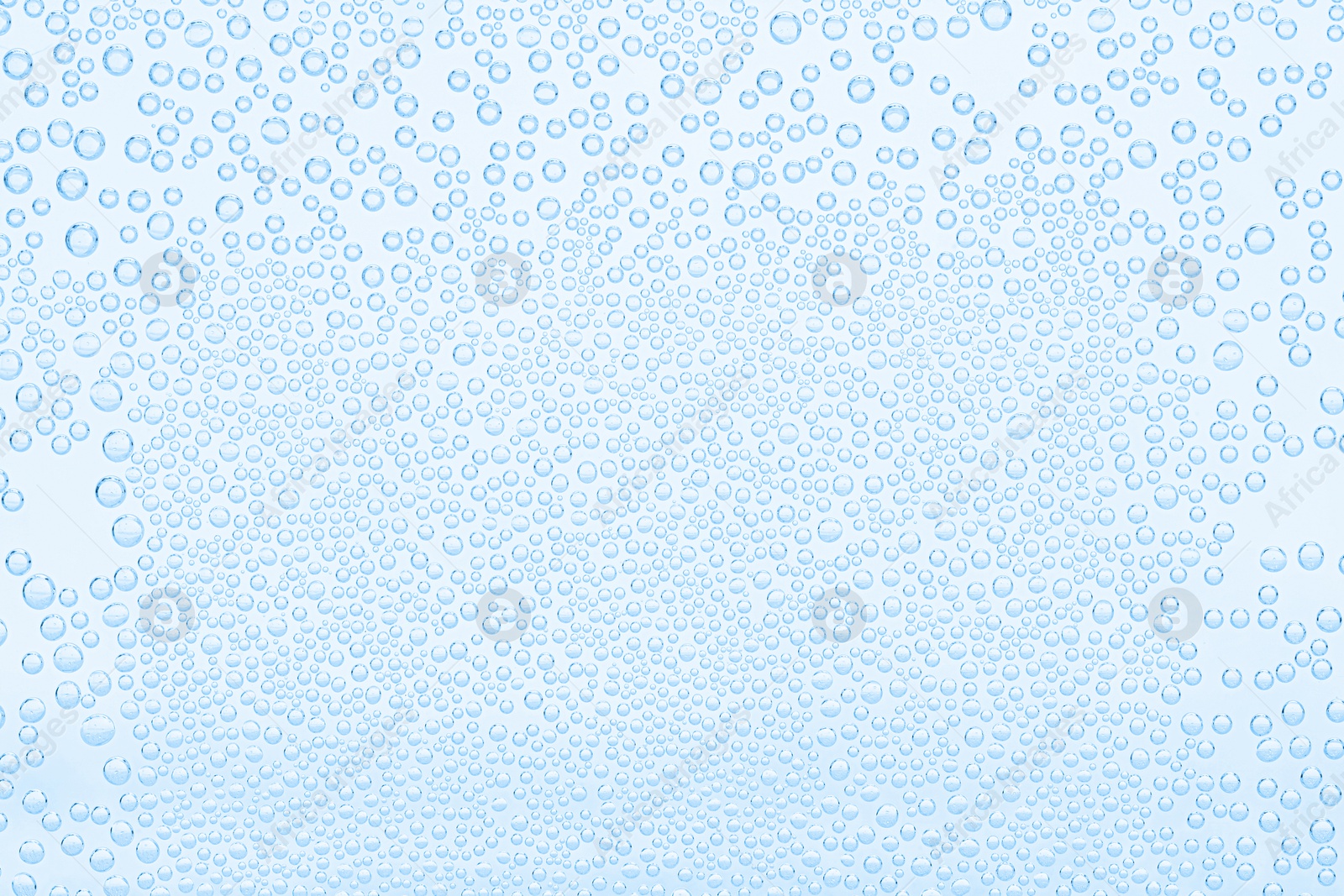 Soda water with bubbles as background, closeup Image of Soda water with bubbles as background, closeup