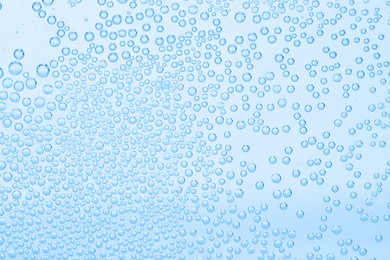 Image of Soda water with bubbles as background, closeup