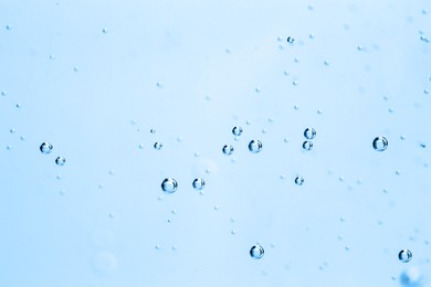 Image of Soda water with bubbles as background, closeup