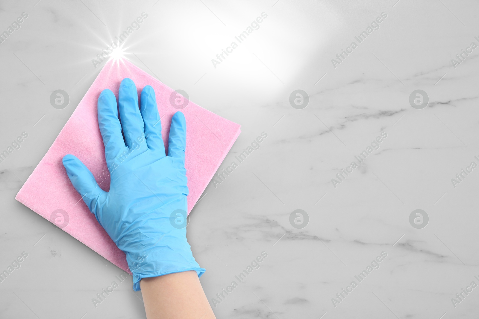 Cleaning service worker in rubber glove washing white marble surface with rag, closeup. Shine of purity on cloth Image of Cleaning service worker in rubber glove washing white marble surface with rag, closeup. Shine of purity on cloth