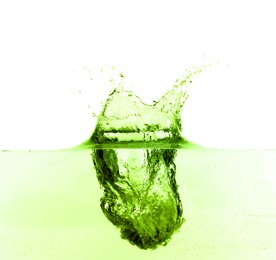 Image of Beautiful green water splashing against white background