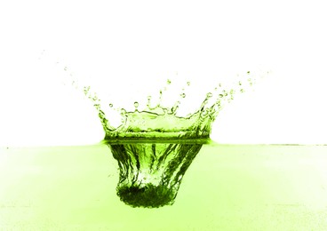 Image of Beautiful green water splashing against white background
