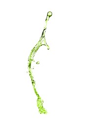 Image of Splash of green water in air on white background