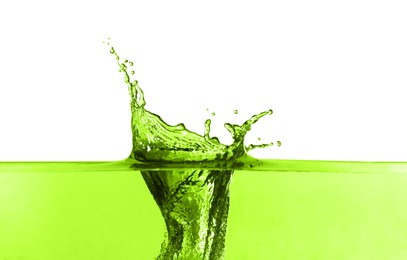 Image of Beautiful green water splashing against white background