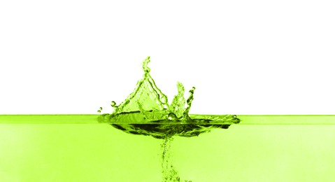 Image of Beautiful green water splashing against white background