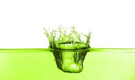 Image of Beautiful green water splashing against white background