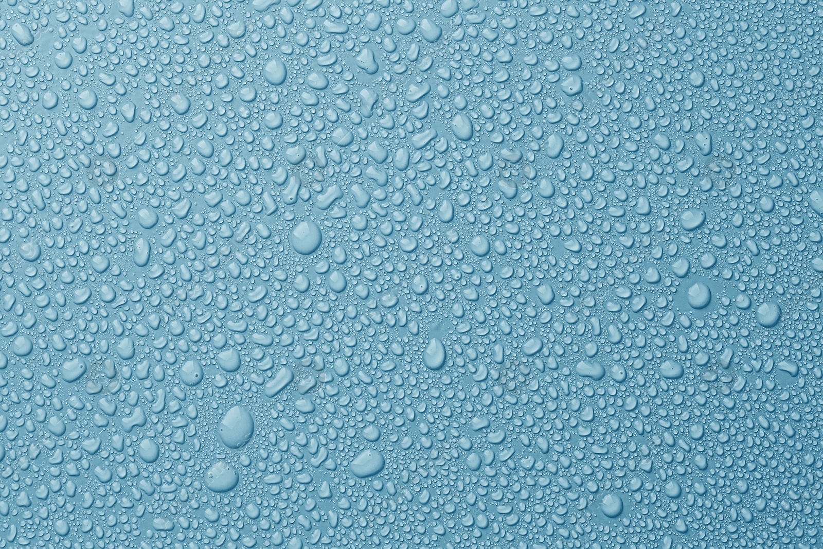 Many water drops on light blue background Image of Many water drops on light blue background