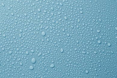 Image of Many water drops on light blue background