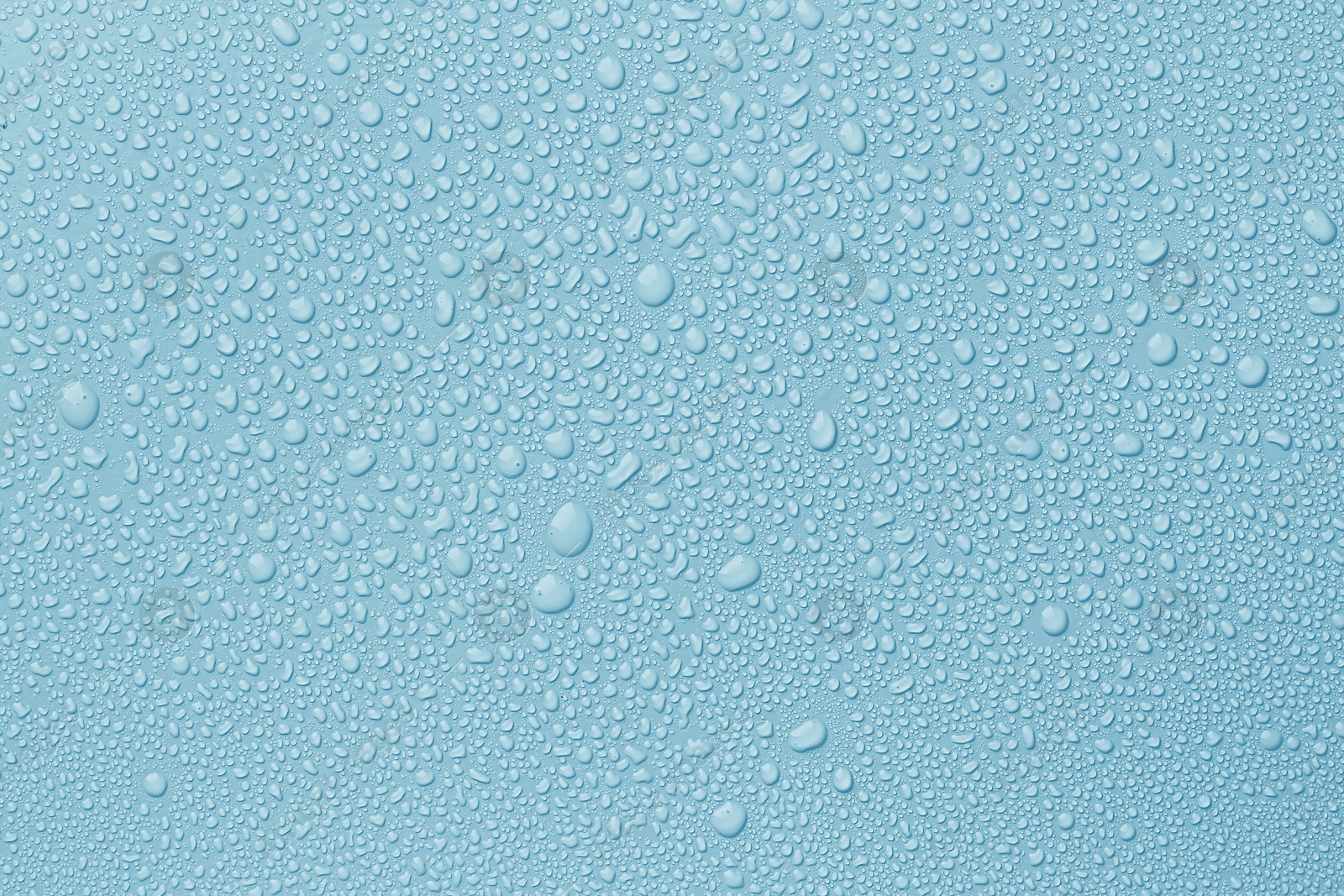 Many water drops on light blue background Image of Many water drops on light blue background