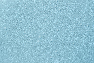Image of Many water drops on light blue background