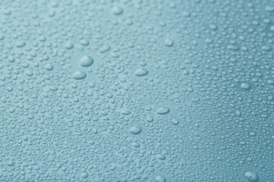 Image of Many water drops on light blue background
