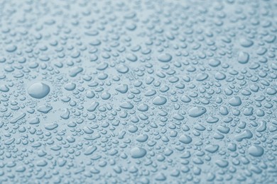 Image of Many water drops on light blue background