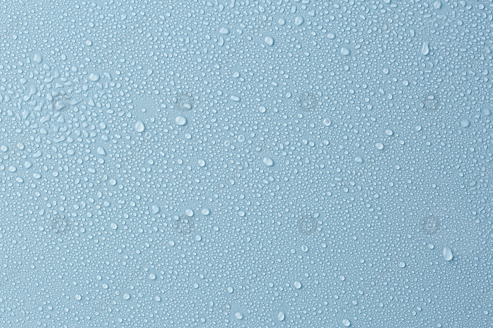 Many water drops on light blue background Image of Many water drops on light blue background