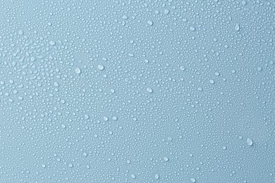 Image of Many water drops on light blue background