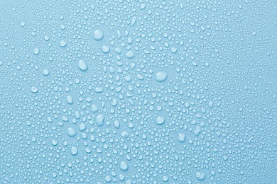 Image of Many water drops on light blue background