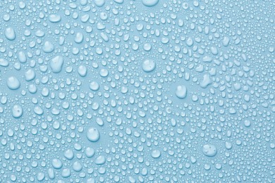 Image of Many water drops on light blue background