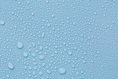 Image of Many water drops on light blue background