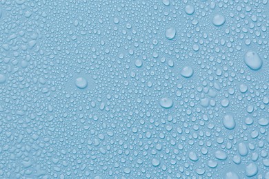 Image of Many water drops on light blue background