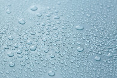 Image of Many water drops on light blue background