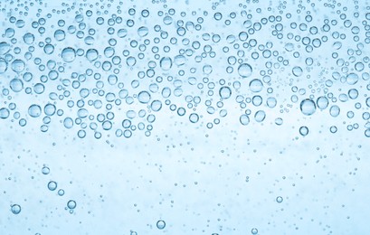 Image of Soda water with bubbles as background, closeup