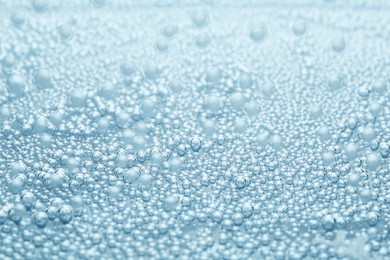 Image of Soda water with bubbles as background, closeup