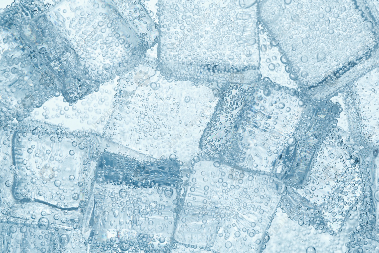 Refreshing soda water with ice cubes as background, closeup Image of Refreshing soda water with ice cubes as background, closeup