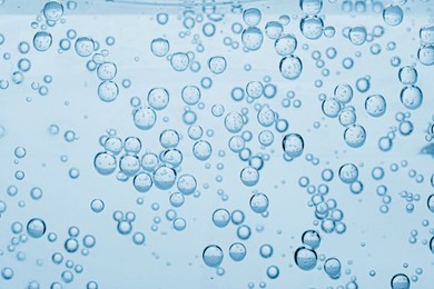 Image of Soda water with bubbles as background, closeup