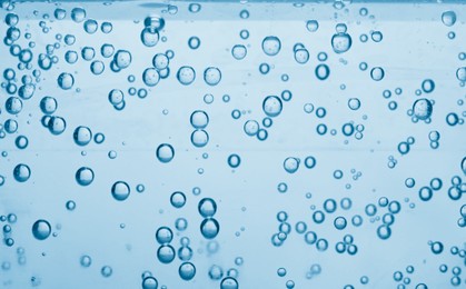 Image of Soda water with bubbles as background, closeup