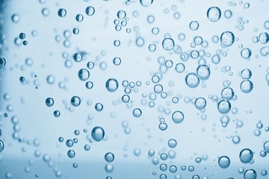 Image of Soda water with bubbles as background, closeup