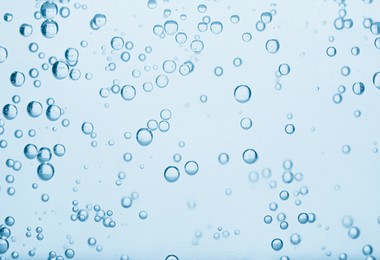 Image of Soda water with bubbles as background, closeup