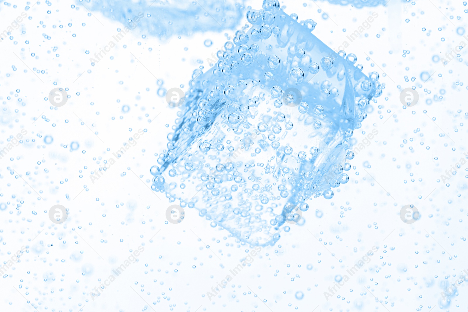 Soda water with ice cubes as background, closeup Image of Soda water with ice cubes as background, closeup