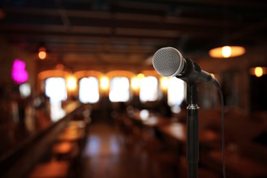 Image of Microphone on stage in restaurant. Singer's performance
