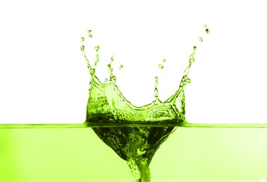 Image of Beautiful green water splashing against white background