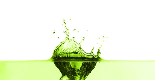 Image of Beautiful green water splashing against white background