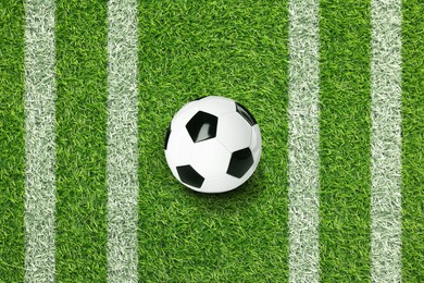Image of Soccer ball on football field with markings