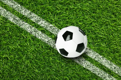 Image of Soccer ball on football field with markings