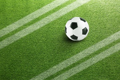 Image of Soccer ball on football field with markings