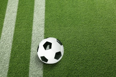 Image of Soccer ball on football field with markings