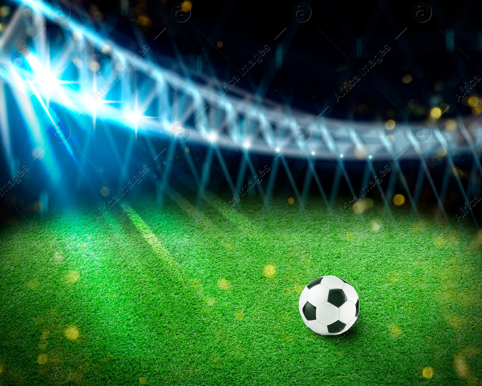 Soccer ball on green grass at football stadium, space for text Image of Soccer ball on green grass at football stadium, space for text