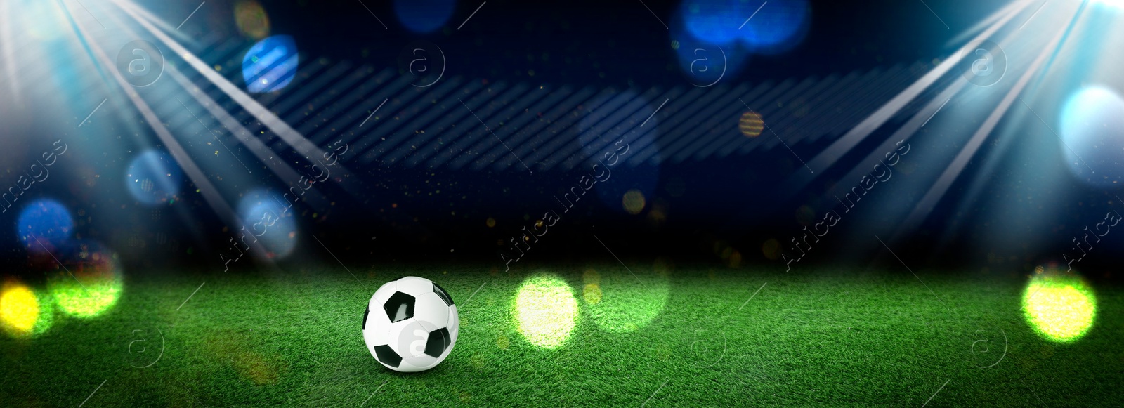 Soccer ball on green grass at football stadium, space for text. Banner Image of Soccer ball on green grass at football stadium, space for text. Banner