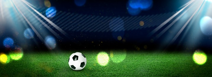 Image of Soccer ball on green grass at football stadium, space for text. Banner