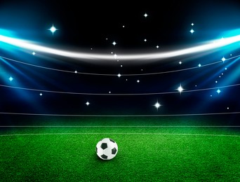 Image of Soccer ball on green grass at stadium. Football game